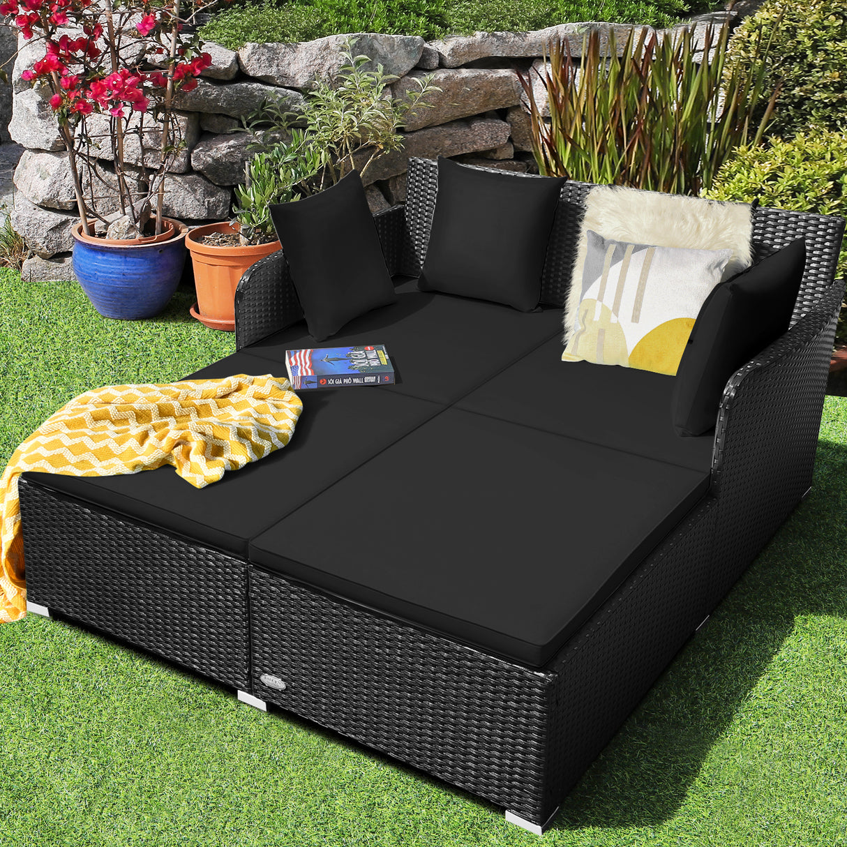 Spacious Outdoor Rattan Daybed with Upholstered Cushions and Pillows