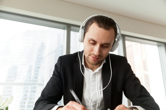 Listening to Music or Podcasts While Working: Benefits and Tips